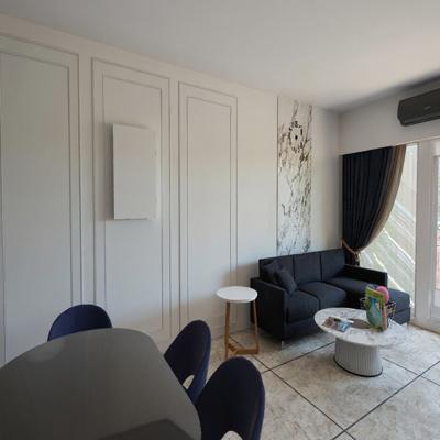 Compact Living Room Design with Marble Accent Strip and Dark Sofa