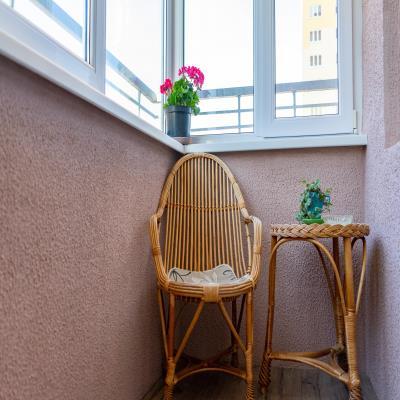 Simple Modern Balcony Design with Wicker Furniture.