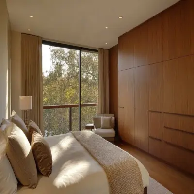 Mid-Century Modern Master Bedroom Design With 3-Door Wooden Sliding Wardrobe