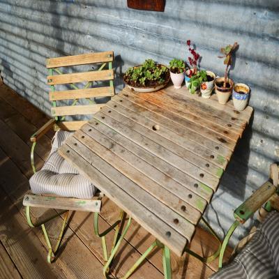 Cosy Contemporary Balcony Design with Rustic Chairs and Tables