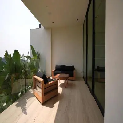 Elegant Balcony Design with Wooden Table and Chairs