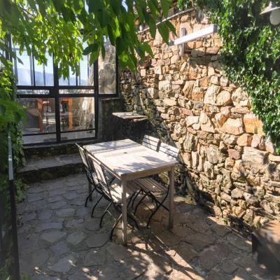 Cosy Balcony Design with Rustic Chairs and Tables