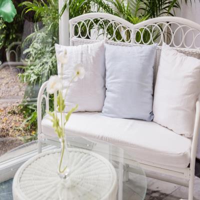 Elegant Modern Balcony Design with Cane Furniture