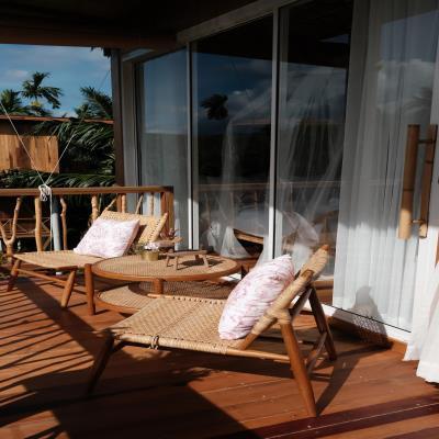 Elegant Balcony Design with Rustic Chairs and Tables