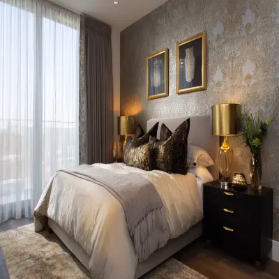 Contemporary Bedroom Design With A King Size Bed And Patterned Wallpaper