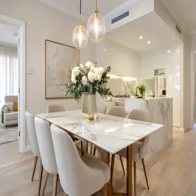 Contemporary Dining Room Design With Marble Table and Taupe Chairs