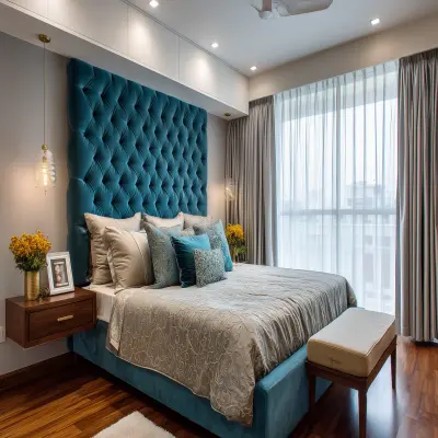 Contemporary Master Bedroom Design With Teal Tufted Headboard And Overhead Storage