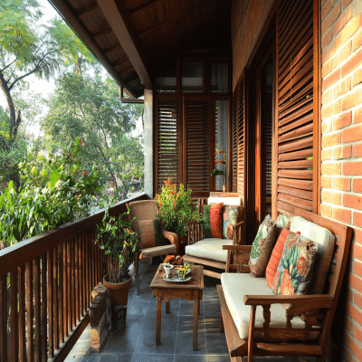 Indian Traditional Balcony Design with Brick Wall and Wooden Furniture